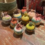 colorful rainbow glazed pottery honey pot jugs made by master North Carolinian Cole potters