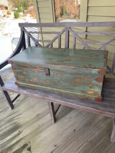 Antique painted trunk with chunky iron handles