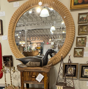 Coastal organic wicker vintage mirror is for sale in the shop. This vintage 36-inch round mirror features a solid wood frame wrapped with a thick band